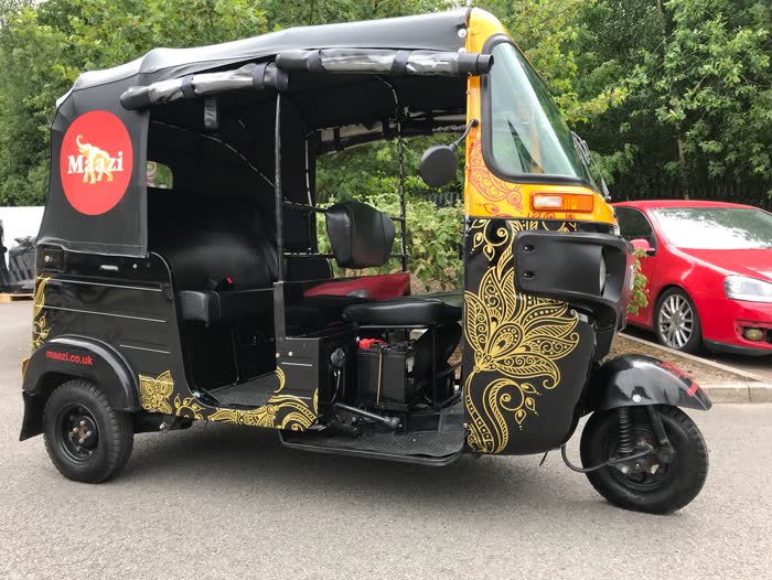Marci restaurant tuk tuk in black with gold paisley artwork