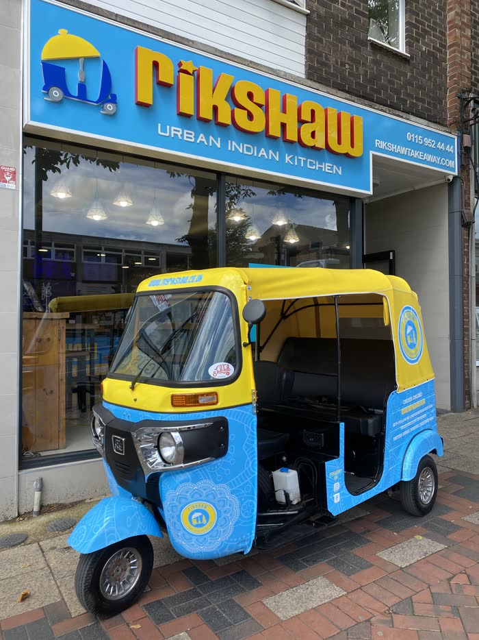 Rikshaw Urban Indian Kitchen tuk tuk parked outside the restaurant