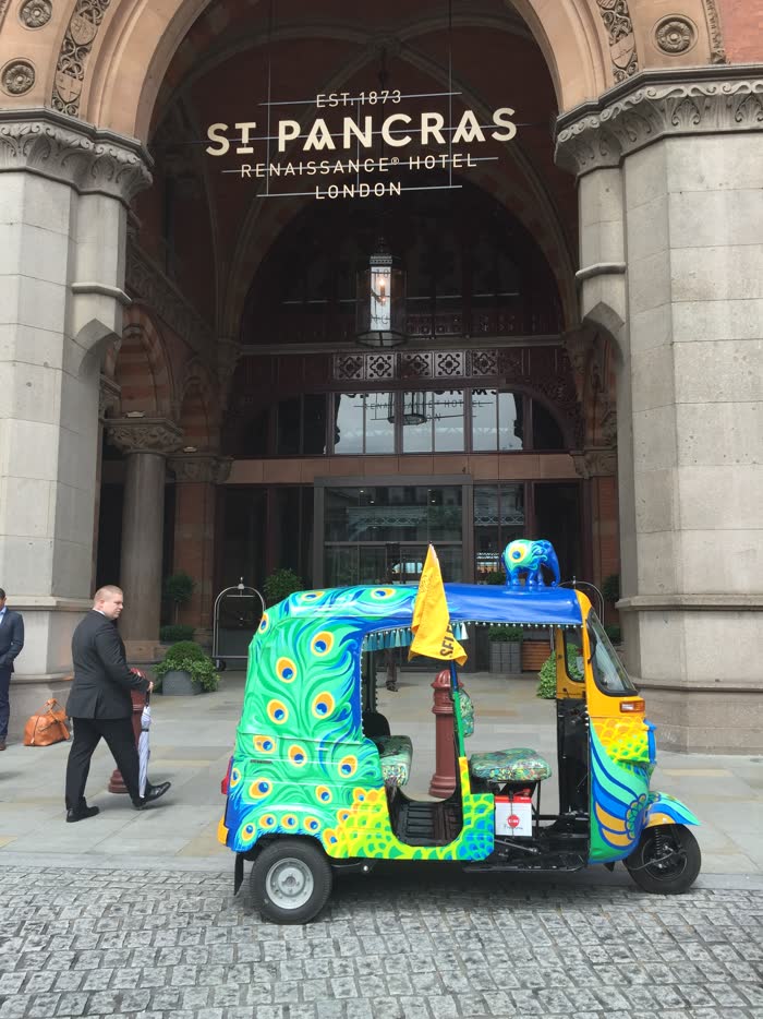 Brightly painted tuk tuk outside the St Pancras Renaissance Hotel, London