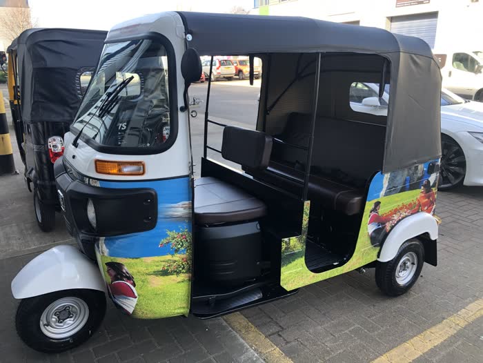 Scenic landscape photo wrap covering a whole tuk tuk