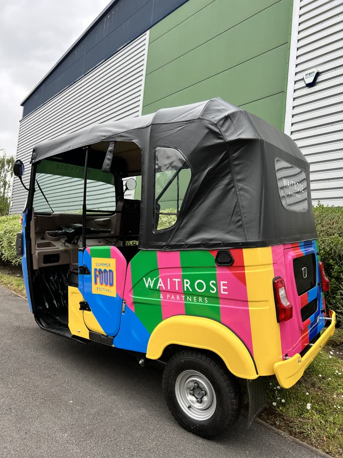Rear view of the Waitrose & Partners branded tuk tuk